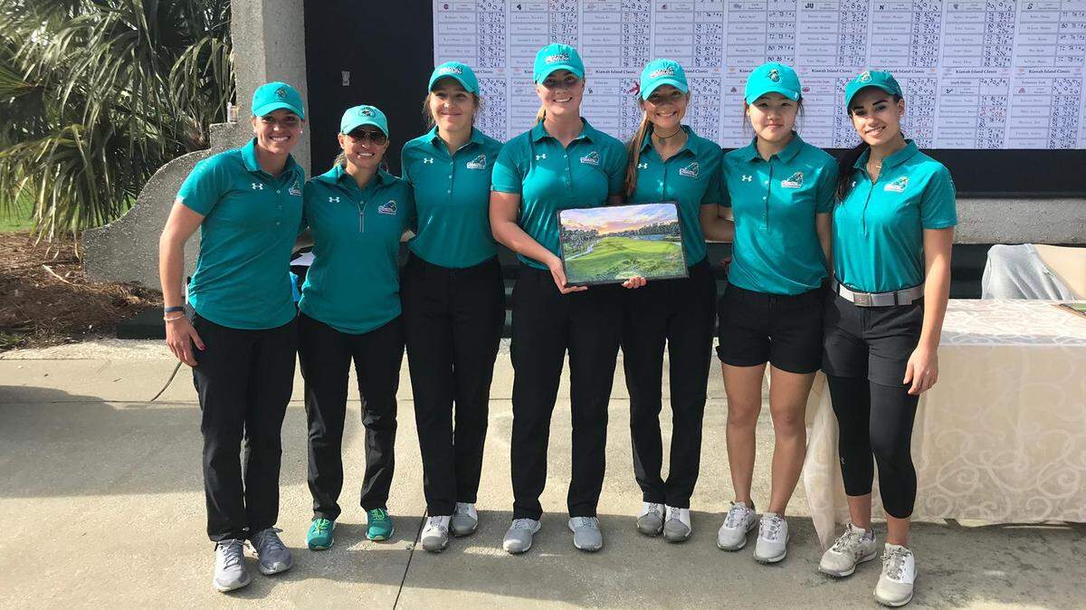 The Coastal Carolina women’s golf team poses with the championship trophy Tuesday after sharing the team title with North Florida in the Kiawah Island Spring Classic.