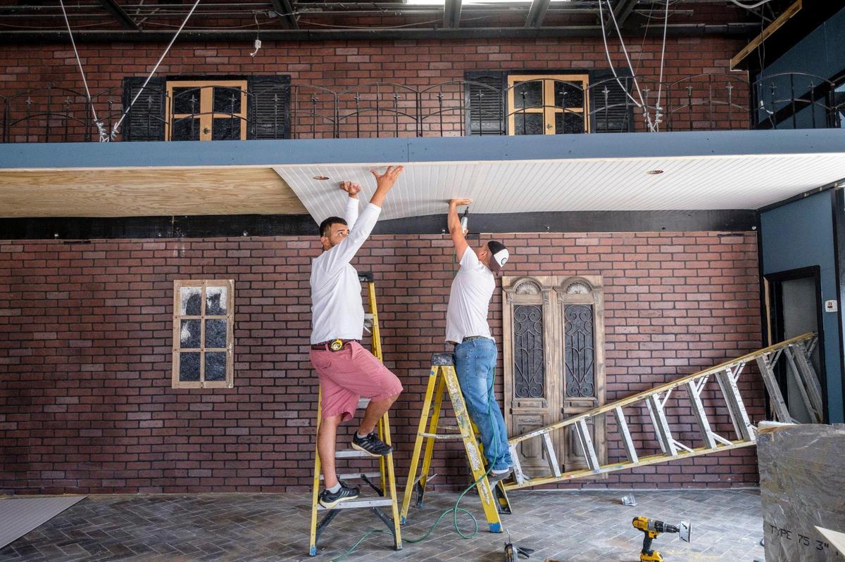 Workers rush to finish construction on Nola’z New Orleans Dueling Piano Bar and Eatery set to open by Thursday, June 10, 2021 on the corner of 9th Avenue North and Withers Drive in Myrtle Beach. The restaurant, plans feature New Orleans decor and traditional foods with open garage doors to allow for the public to take part in the entertainment. June 7, 2021.