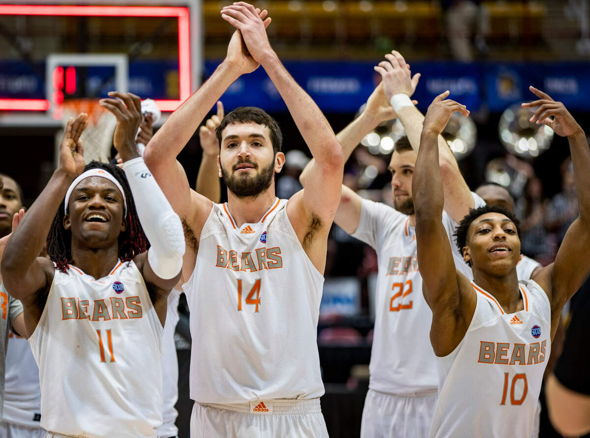 Mercer celebrates after defeating Western Carolina 81-53 Friday night in the SoCon Ingles Basketball Championships at the Harrah’s Cherokee Center in Asheville, N.C.