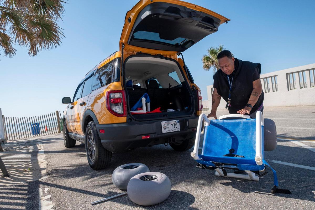 Unita Knight assembles the beach wheelchair she purchased for almost $1,000 to take her 90-year-old mother Joan Pulliam to the beach. Myrtle Beach Police department has discontinued providing beach wheelchairs. April 19, 2023.
