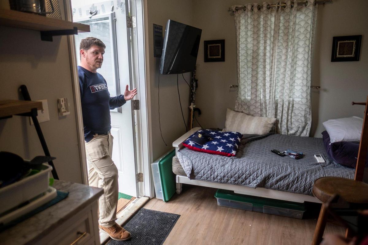 Scott Dulebohn, Executive Director of the The Veteran’s Welcome Home and Resource Center shows the model tiny home that houses previously homeless veterans at their Little River, S.C. location. The homes are 144 Square Feet of living space for veterans that would otherwise be homeless.The organization is currently building 25 tiny homes on Third Avenue North in Myrtle Beach that are expected to be completed in the next six weeks. December 6, 2022.