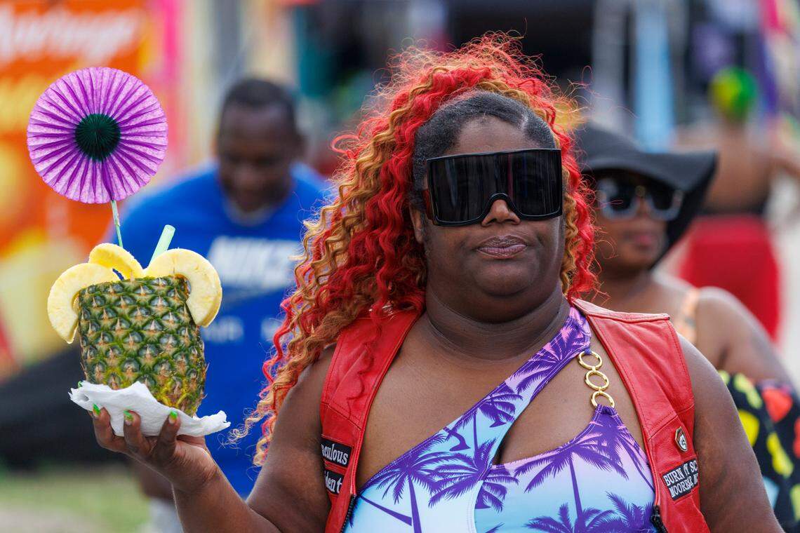 A festival attendee enjoys one of the signature pineapple cocktails at The Atlantic Beach Black Pearl Cultural Heritage and Bike Festival in Atlantic Beach. May 23, 2025.