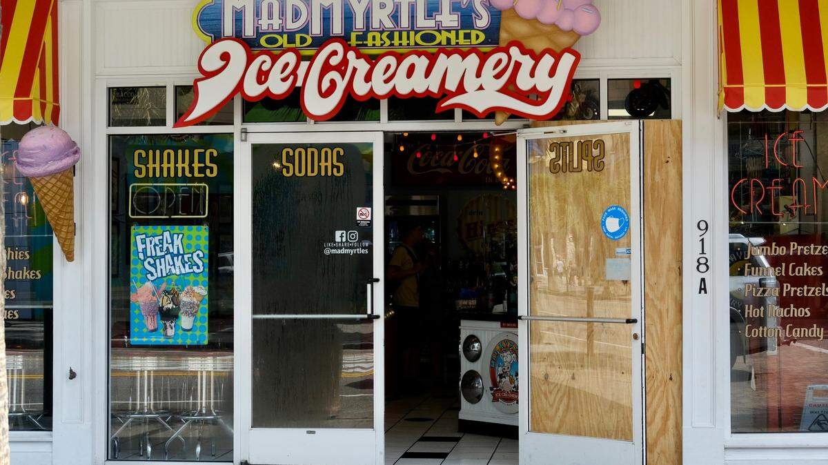 Stray bullets hit the front of Mad Myrtle Ice Creamery, shattering the storefront window during a Labor Day shooting. No one inside the restaurant was injured.