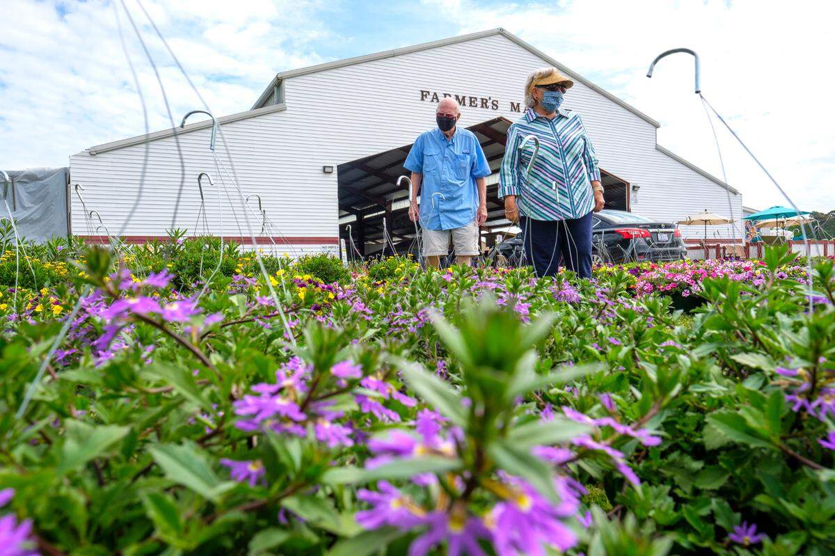 Marilyn Henderson and Charlie Hanson shop for flowers at the Pee Dee State Farmers Market. The Pee Dee State Farmers market is set to host the Plant and Flower Sale April 22-25. The event, expected to bring over up to 22,000 visitors, was closed last year due to the COVID-19 pandemic. The three state farmers markets in S.C. were set up by the S.C. Department of Agriculture to support local farming in the region. April 15, 2021.