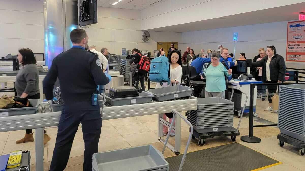 Travelers pass through the Myrtle Beach International Airport security checkpoint on Feb. 25, 2025.