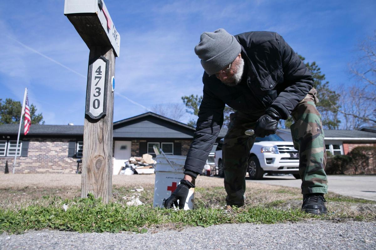 John Russell, 68, picks up the last bits of storm debris that remains in his front yard after nearly four months since Hurricane Florence flooded his Cottonwood Drive home. Russell, who has lived in the Rosewood Community for 33 years, says he will be selling his home and moving when restoration is finally complete. Residents in the Rosewood neighborhood are still trying to recover with some opting to leave their homes for good following the flooding from Hurricane Florence over four months ago. Jan 30, 2019.