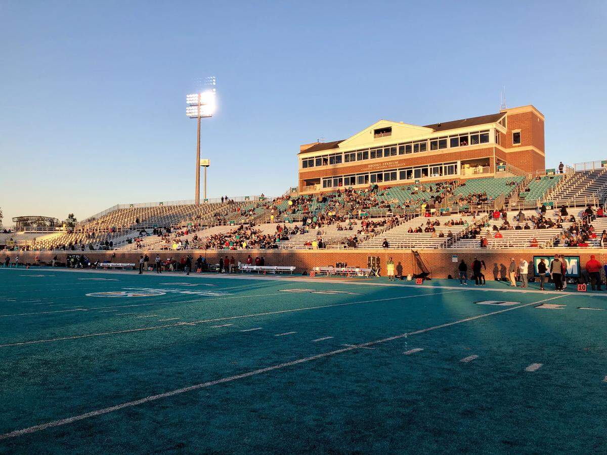 The home side stands are sparsely populated just before kickoff of Coastal Carolina’s game against Arkansas State last Saturday at Brooks Stadium in Conway.