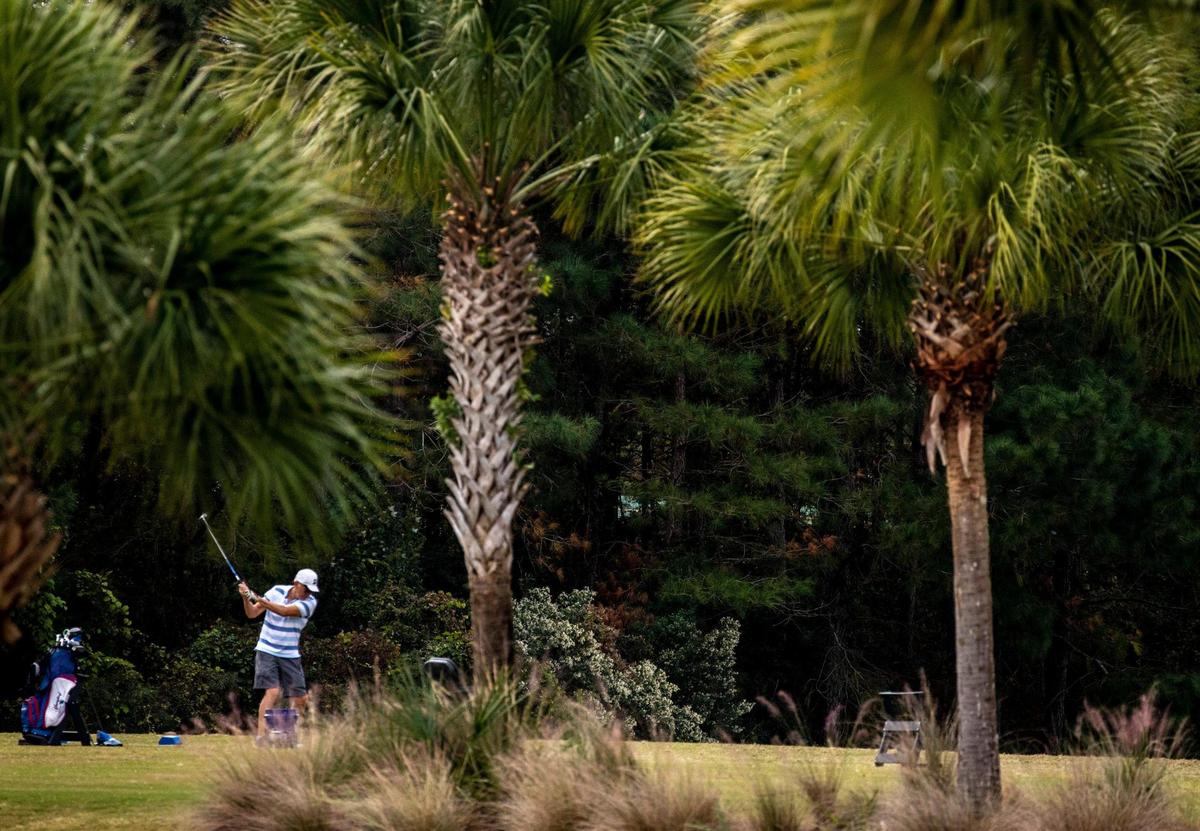 A golfer tees off on the driving range at the International Club of Myrtle Beach located in Murrells Inlet, S.C. November 10, 2020.