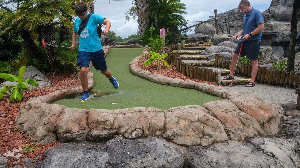 Visitors play miniature golf at Hawaiian Rumble Golf in North Myrtle Beach, S.C. The course, known as the “Home of the Masters” has hosted the U.S. ProMiniGolf Association Master’s tournament for twenty-seven years. July 12, 2024. The next USPMGA tournament will be start on October 8, 2024.