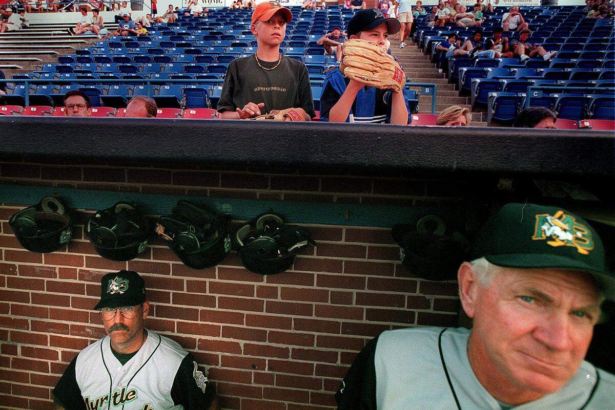 Pelicans Manager Brian Snitker, left, and pitching coach Bruce Dal Canton sit in the dugout during a game in 2000.