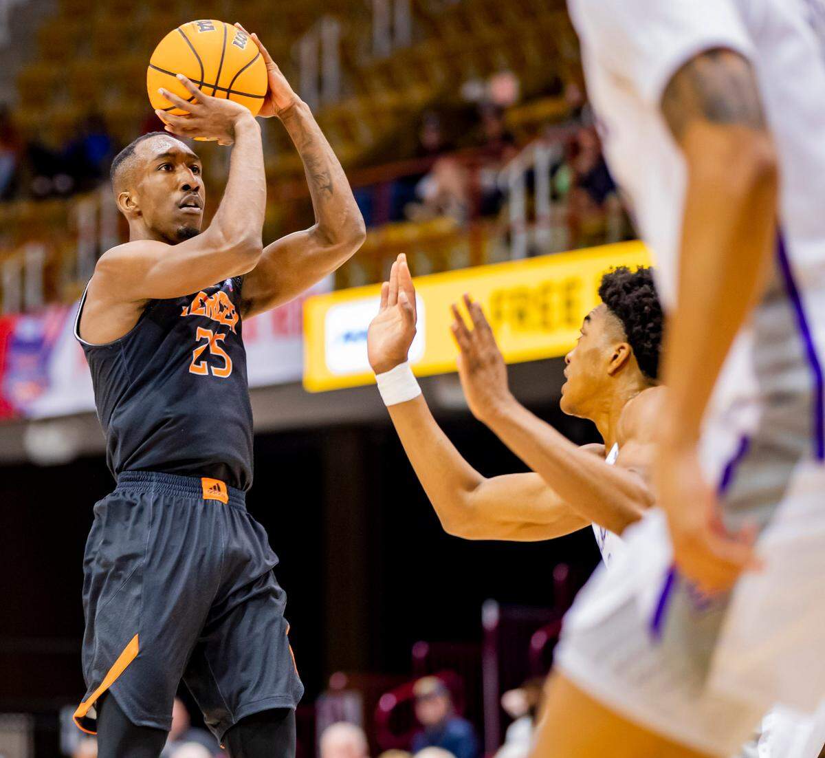 Mercer junior guard Shawn Walker Jr. shoots against Furman Saturday afternoon in the SoCon Ingles Basketball Championships at the Harrah’s Cherokee Center in Asheville, N.C.