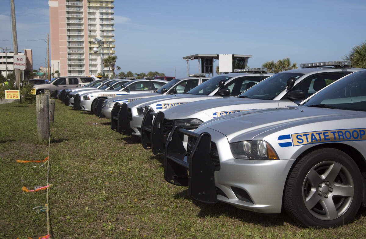 Law enforcement and media vehicles line up at the end of 30th Avenue South in Atlantic Beach on Saturday, May 26, Day 2 of BikeFest.