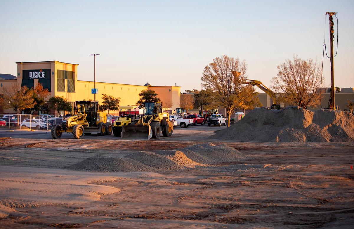 Crews work to construct a Golf Galaxy next door to Dick’s Sporting Goods at Coastal Grand Mall Wednesday afternoon.