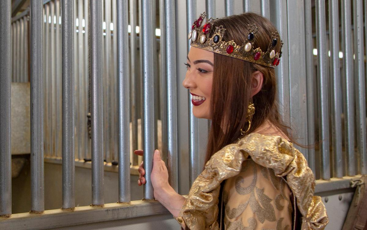 Chloe Hudson, who plays the first queen of the Medieval Times castle in the production company’s new show, interacts with a horse backstage at Medieval Times in Myrtle Beach.