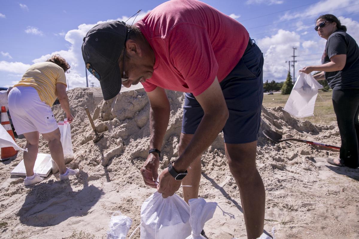 Anthony Alexander bags free sand provided by the City of Myrtle Beach on Monday that he hopes will protect his Market Common home from flooding. Myrtle Beach residents and businesses prepare for Hurricane Florence as it storms towards the coast on Monday. September 10, 2018.