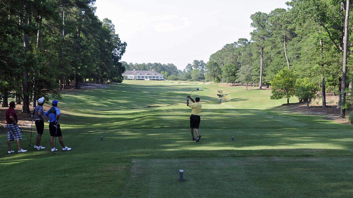 A golfer tees off on the 18th hole at TPC Myrtle Beach in Murrells Inlet. TPC Myrtle Beach is one of the best public golf courses in Myrtle Beach, according to Golfweek Magazine.