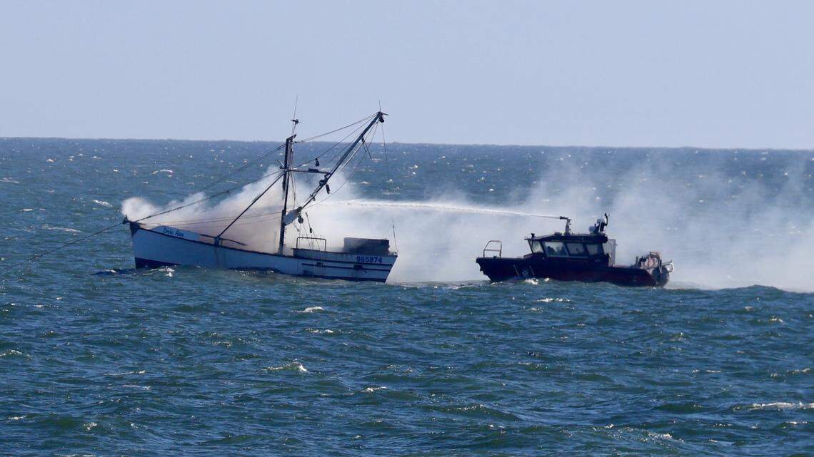 A shrimp boat off the shore near the Cherry Grove Pier in North Myrtle Beach was on fire Monday, Oct. 6, 2025. Fire crews are responding to the scene and crew members are being brought to shore.