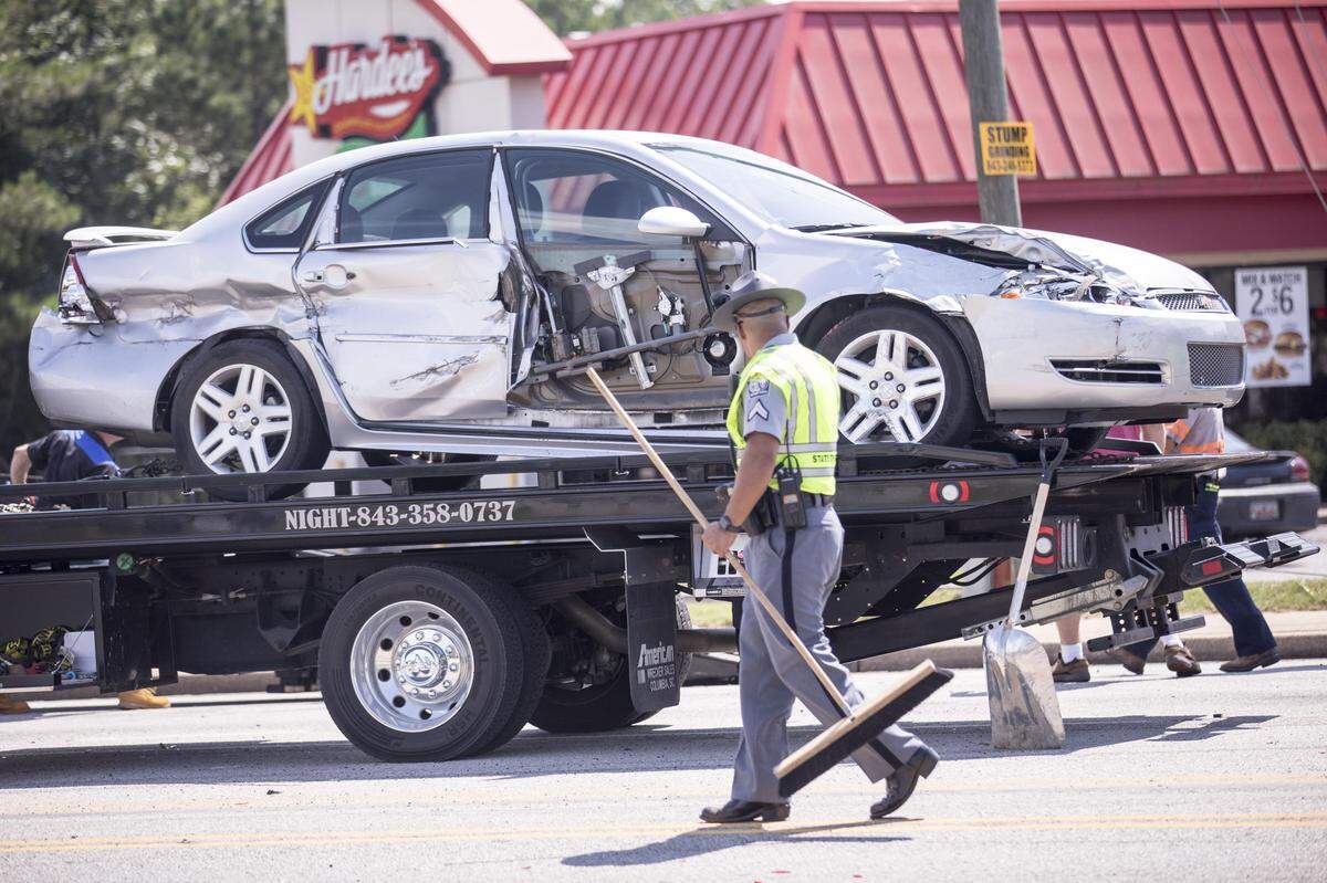 Emergency personnel clean up after a multi-vehicle wreck in Aynor on Tuesday afternoon that resulted in several injuries.July 17, 2018.