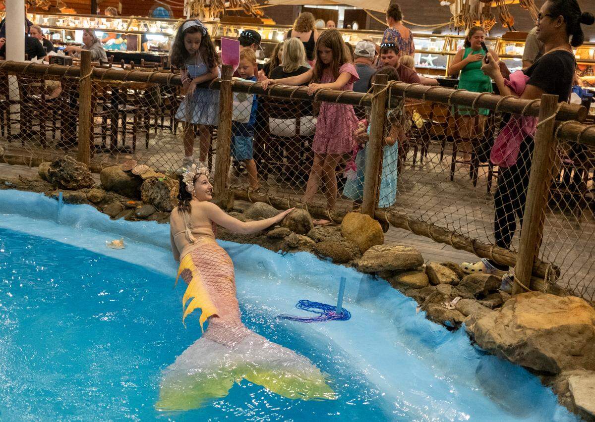 Haley the mermaid performs at Pirate’s Table Calabash Seafood Buffet. In addition to working as a professional performer at the restaurant and children’s events, she makes tails and other mermaid accessories in her home studio. The mermaid has over two million TikTok followers June 28, 2023.