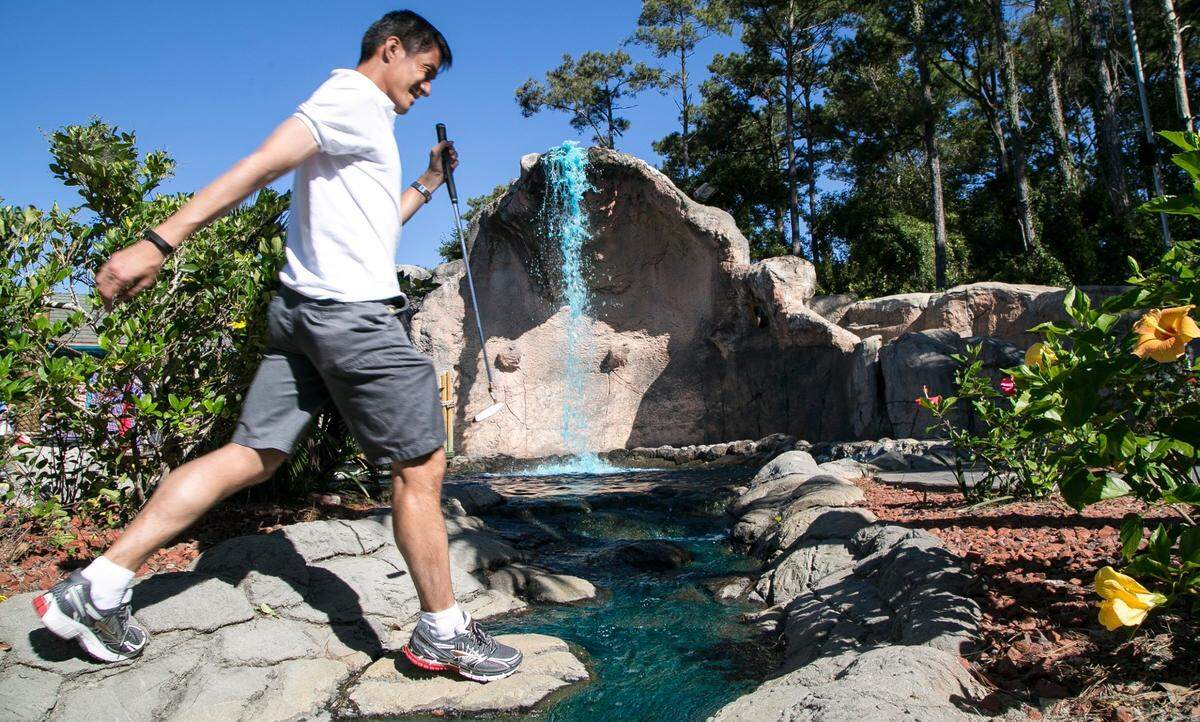 Eric Chiang jumps a water hazard at Hawaiian Rumble Mini Golf. The U.S. Pro Mini-Golf Association Masters Championship Tournament is being held at Hawaiian Rumble and Hawaiian Village this week with proceeds benefitting Canine Angels.