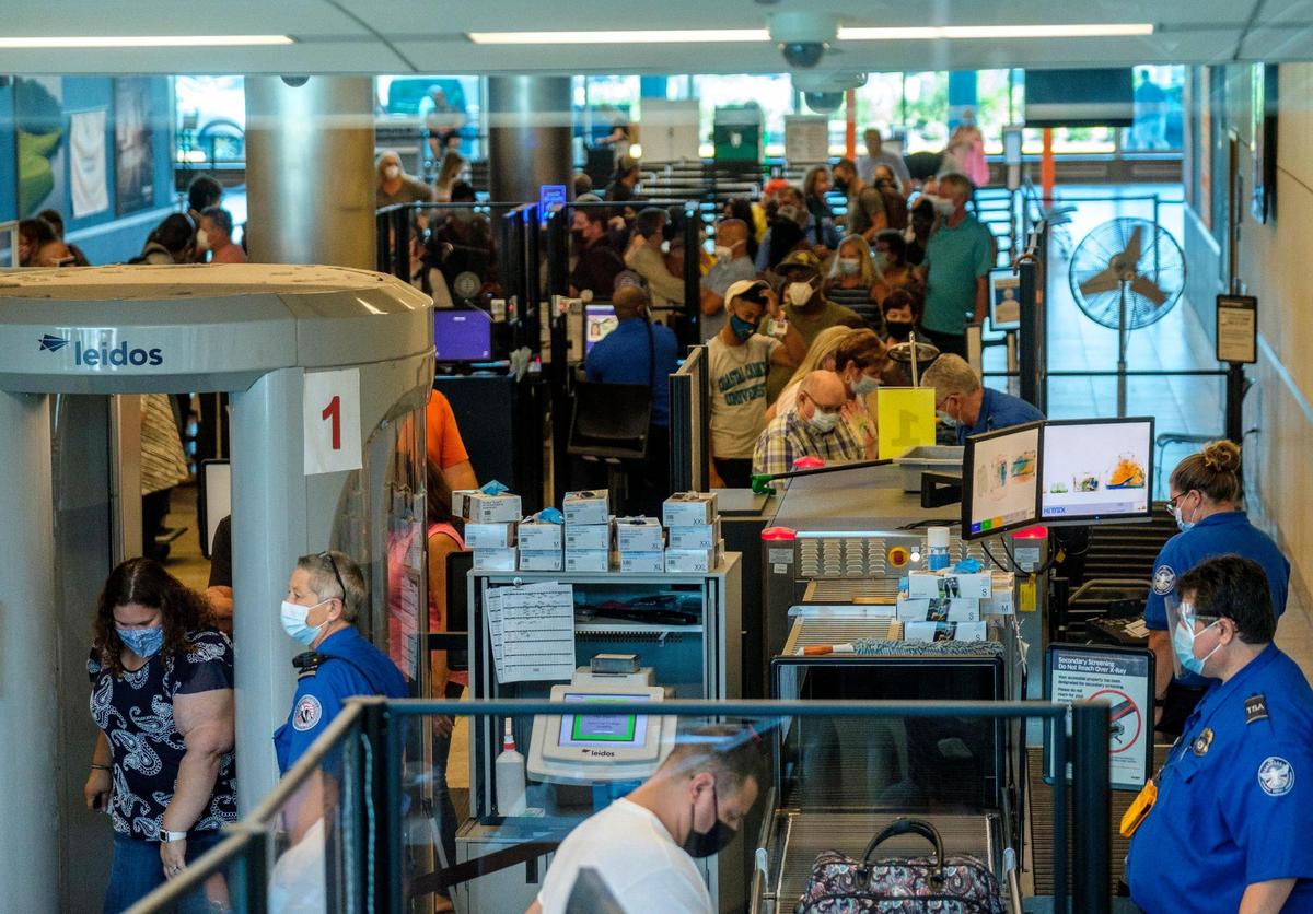 Travelers make their way a TSA checkpoint at Myrtle Beach International Airport (MYR.) Oct. 14, 2021.