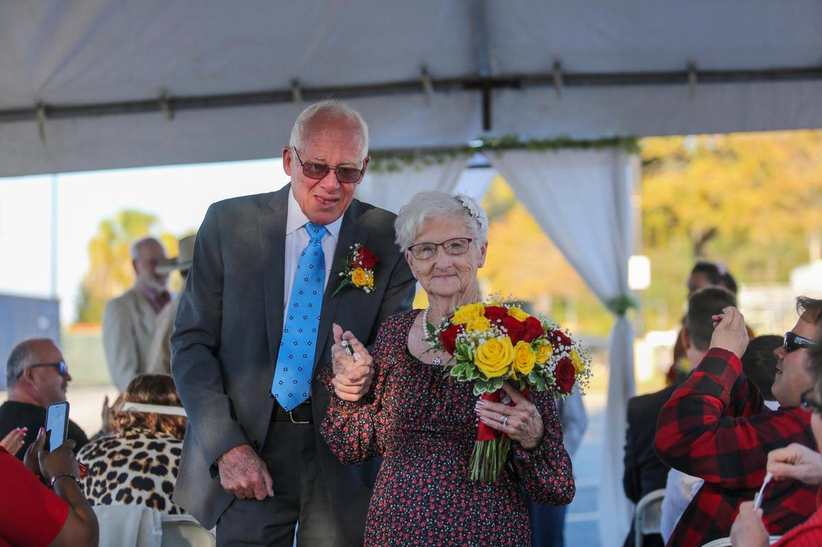 Jane Billedeaux and Harris Putnam, both 82-years-old, married Saturday in the parking lot of the Walmart where Billedeaux works as a host. Nov. 13, 2021.