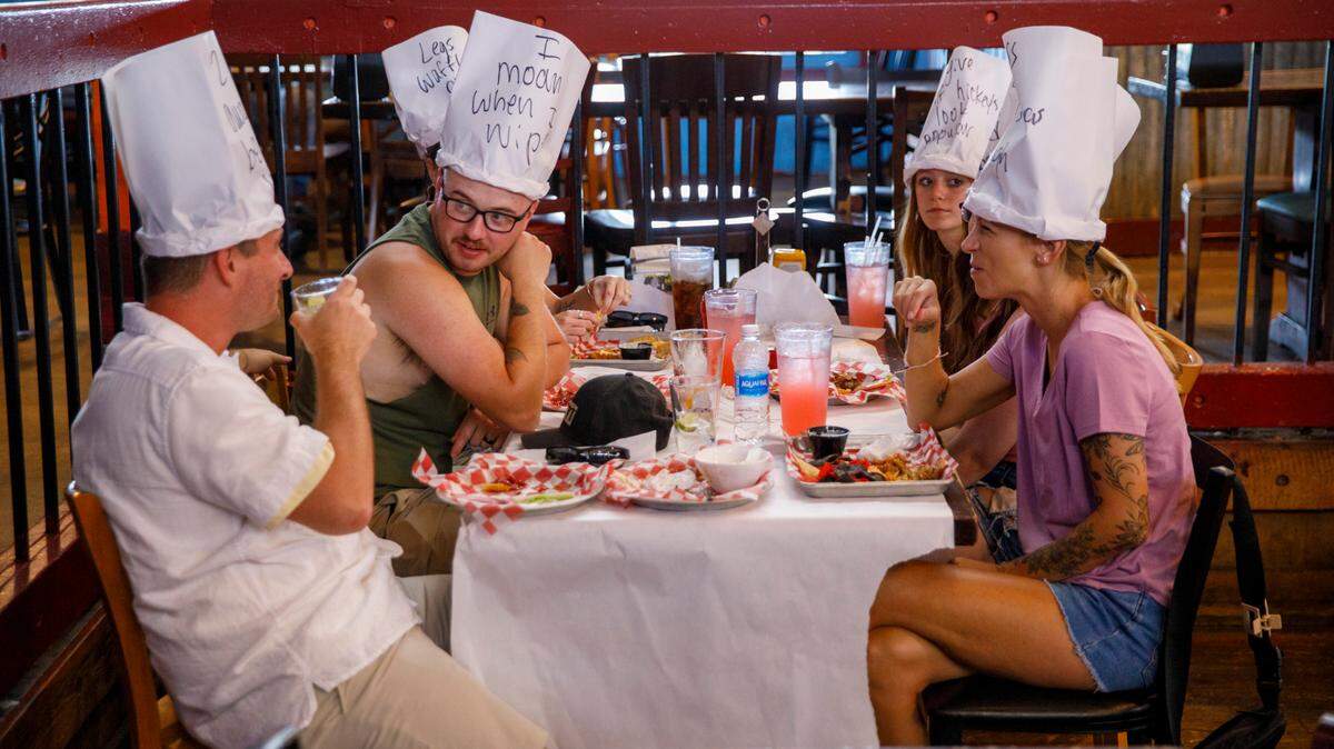 Customers wear paper hats created by their servers. An inside look at Dick’s Last Resort at Barefoot Landing in North Myrtle Beach, a theme restaurant where visitors can expect light hearted jokes from the staff. The first Dick’s Last Resort opened in Dallas in 1985. The Barefoot Landing location opened in 1992 and today the chain has 12 locations around the country. Aug. 12, 2024.
