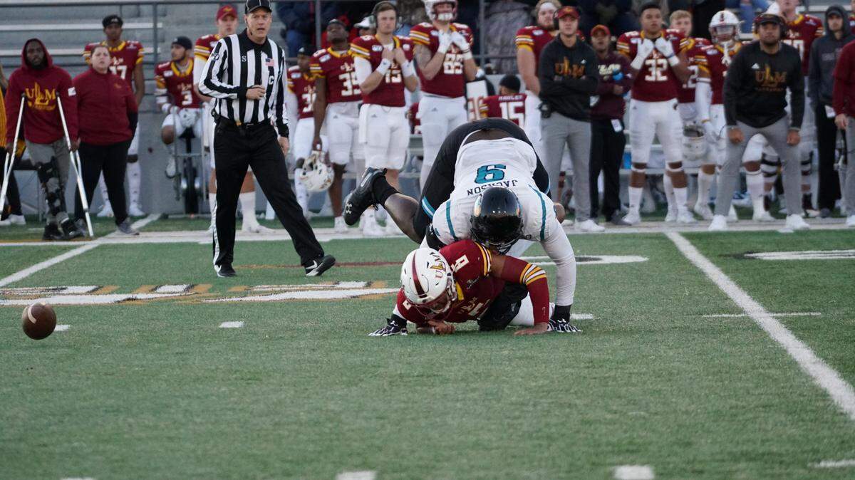 Coastal Carolina junior defensive end Tarron Jackson sacks Louisiana-Monroe quarterback Caleb Evans and causes a fumble in the first half of CCU’s 45-42 loss to the Warhawks Saturday at Malone Stadium in Monroe, La.