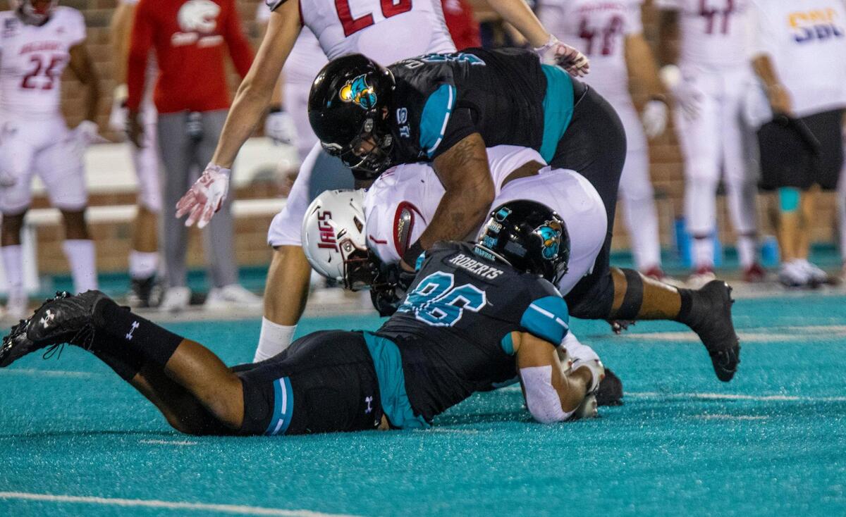 Coastal’s Kennedy Roberts and Jerrod Clark sack South Alabama quarterback Desmond Trotter. Coastal Carolina, ranked No. 15 in this week’s AP Top 25 Poll, played South Alabama on Saturday night in a Sun Belt Conference football game at Brooks Stadium in Conway. November 7, 2020
