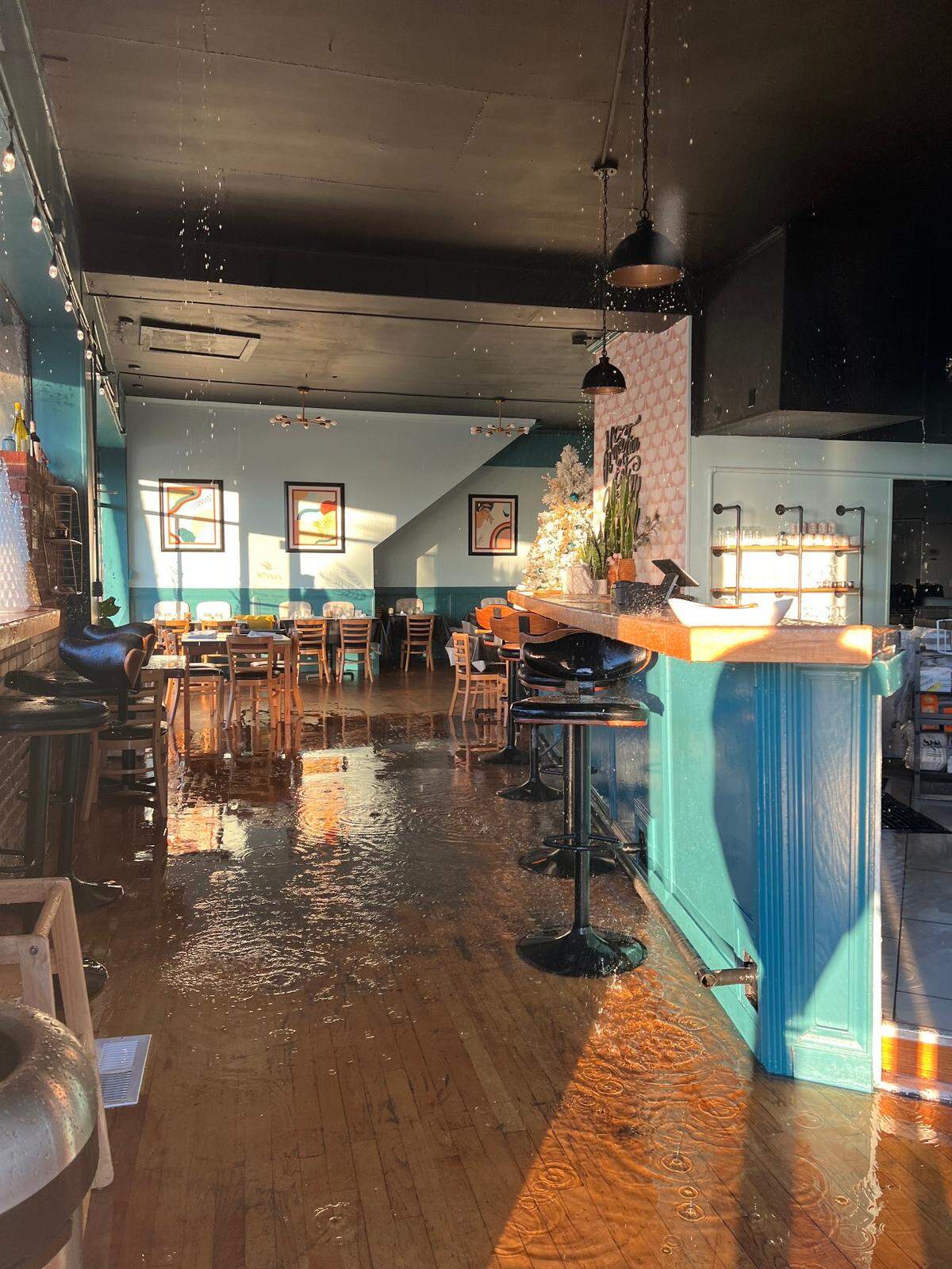 Two inches of water accumulates on the floor of Winna’s Kitchen in downtown Myrtle Beach.