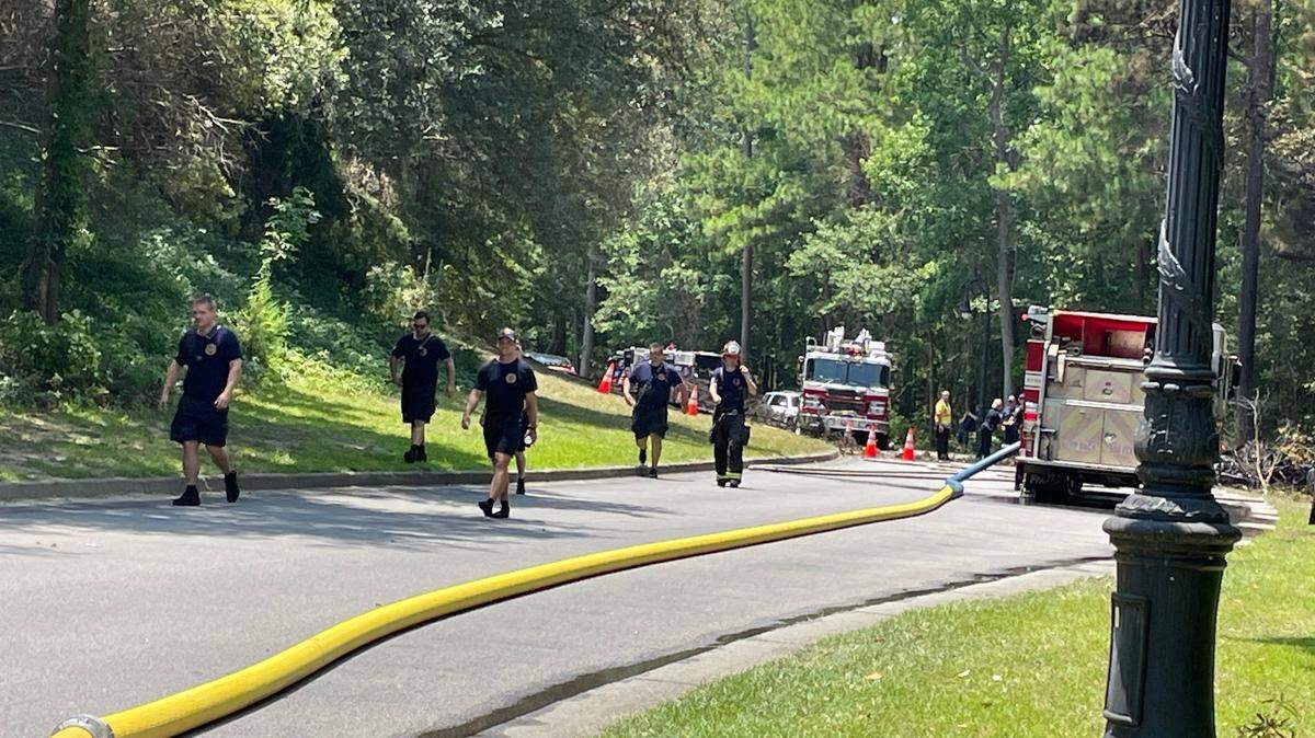 North Myrtle Beach crews responded to a single engine plane crash in the area of Barefoot Landing on July 2, 2023. The plane’s wreckage can be seen near rescue vehicles.