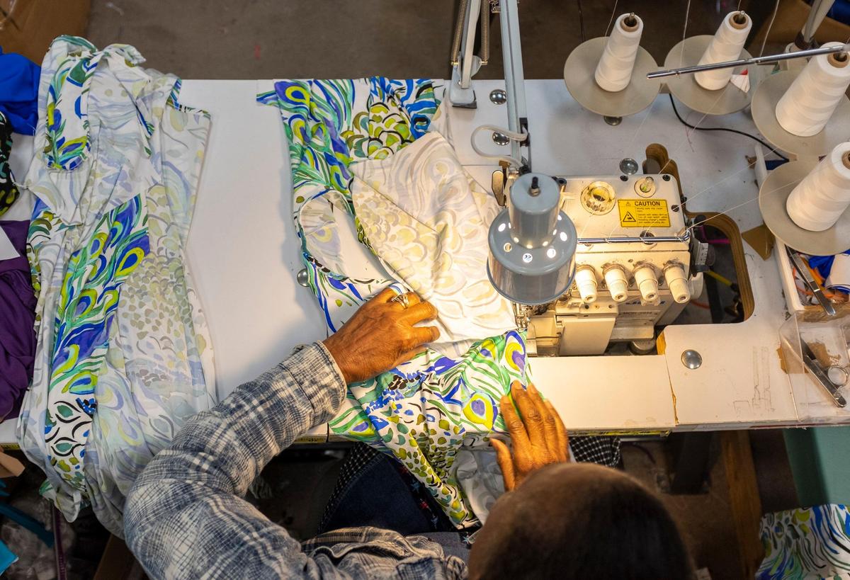 Ophelia Kinlaw, a 10-year employee of Tara Grinna, sews a bathing suit in the Conway factory on Wednesday, June 13, 2019.