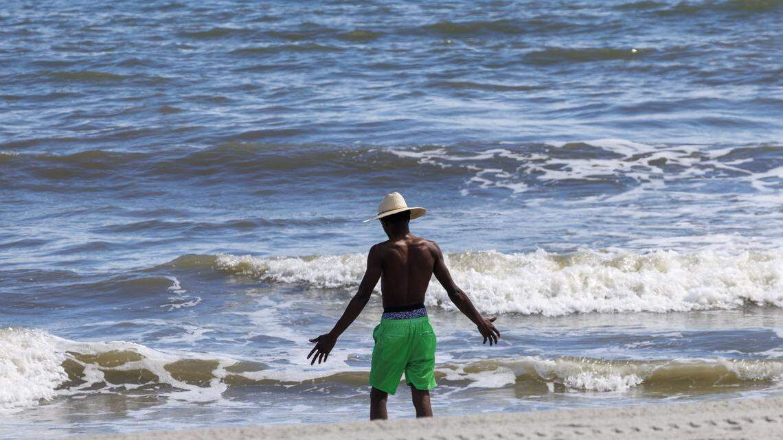 A visitor dips his feet in the water in downtown Myrtle Beach, SC. Sept. 26, 2025
