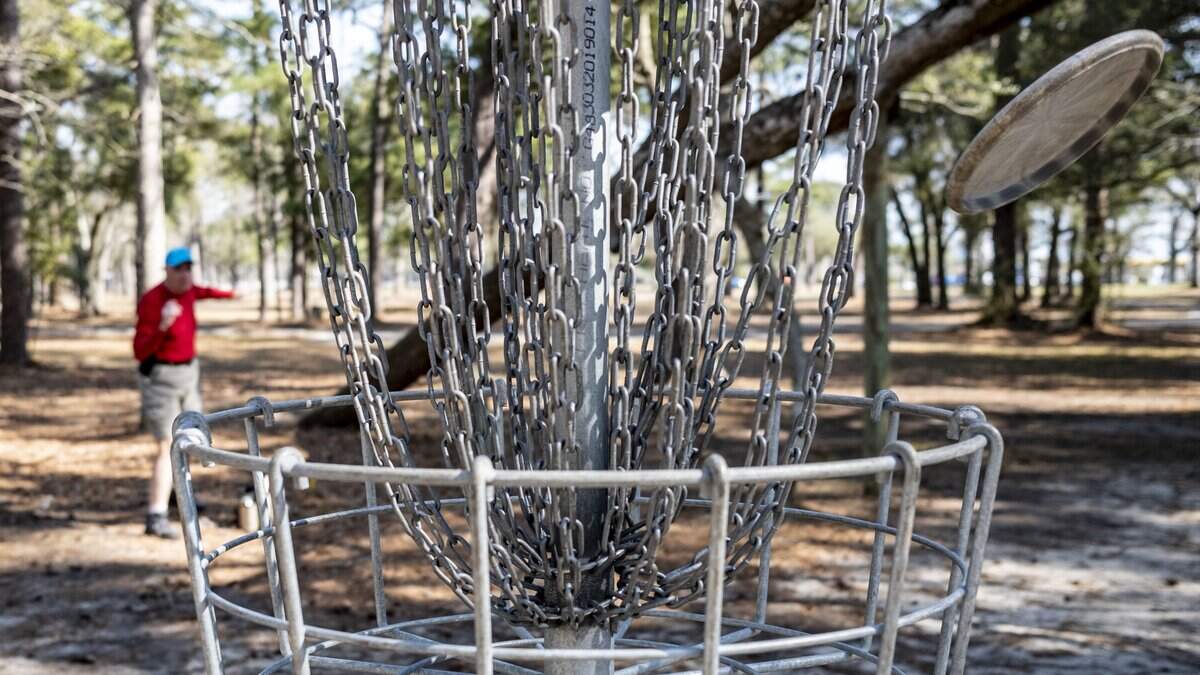 This 2023 photos shows a disc golf player in Myrtle Beach, SC. A new disc golf course has opened in North Myrtle Beach. 