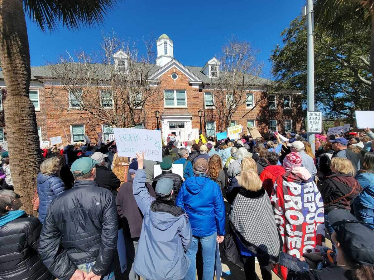 A large crowd packed the lawn outside Myrtle Beach City Hall for an “America has no king” President’s Day protest on Monday, Feb. 17, 2025.