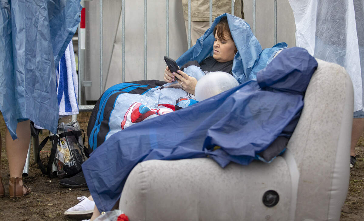 Liz Huth (L) sits on an air sofa Saturday afternoon with her daughter, Annsley McElveen of Turbeville, S.C. at Carolina Country Music Fest in Myrtle Beach.