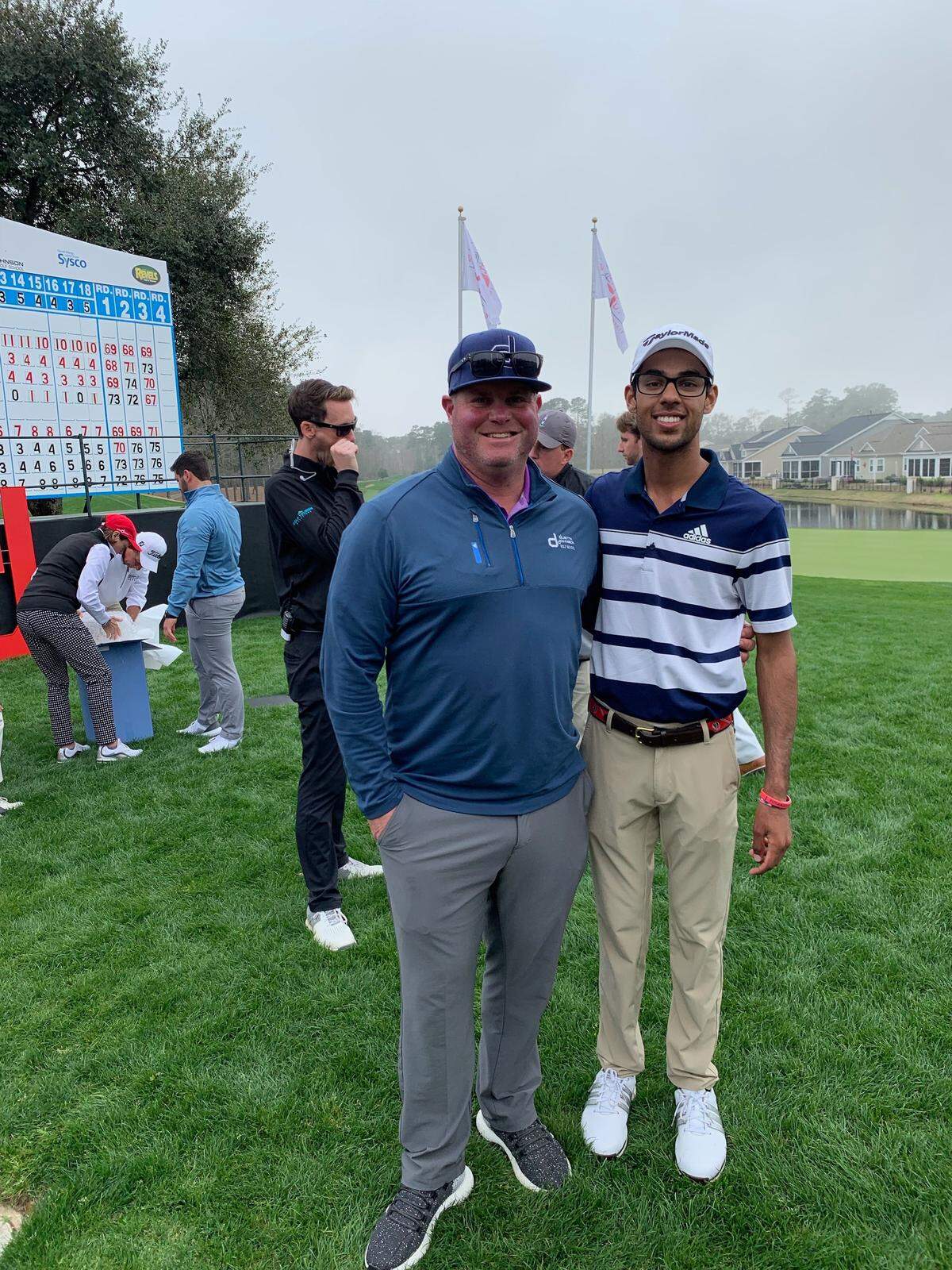 Instructor Allen Terrell with pupil Akshay Bhatia during the 2019 Dustin Johnson World Junior Golf Championship at TPC Myrtle Beach, a tournament Bhatia won with a course-record score.