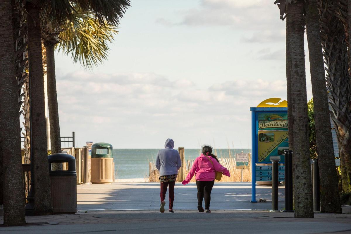 Faith Ruiz, 8, walks with her mother Vanessa during one of their beach walks to the strand in Myrtle Beach. Faith has Bardet-Biedl Syndrome, a rare genetic disorder linked to childhood obesity and vision problems with most of those afflicted going legally blind by age 15. The Ruiz family hopes to travel to Marshfield, Wisconsin to get testing with the nation’s only specialty clinic for BBS but the Ruiz family must first overcome financial burdens before Faith can get the help she needs. January 28, 2021.