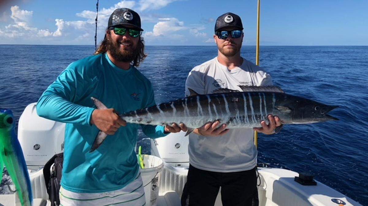 Capt. Alex Hrycak and Chris Lawhon show off a 45-pound wahoo caught aboard Molar Man out of Marlin Quay Marina in August 2018.