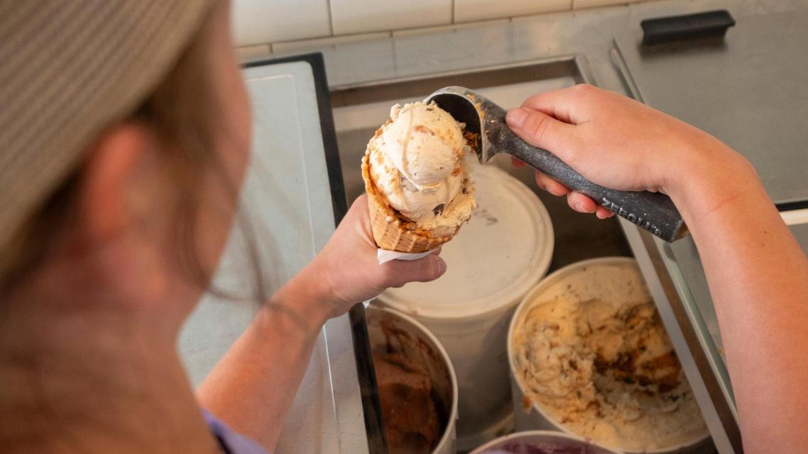 An Melt employee scoops butterfinger ice cream. The ice cream shop on Main Street in North Myrtle Beach, S.C., won the The Sun News’ 2023 reader poll for best ice cream shop in the Myrtle Beach area. June 29, 2023.