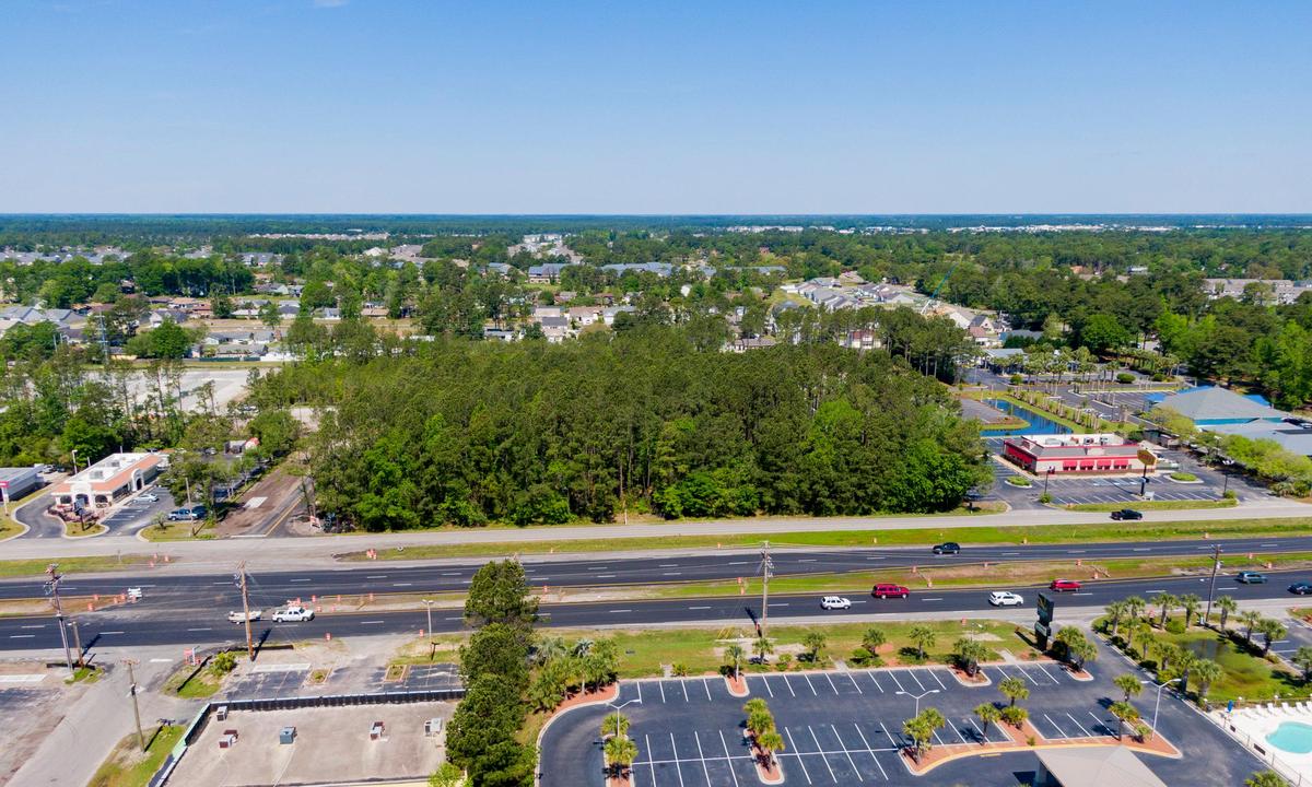 A shot of a wooded lot between Denny’s and Southern Chicken Friday morning along Hwy. 17 in Surfside Beach. The property will be developed by Tideland Commercial.