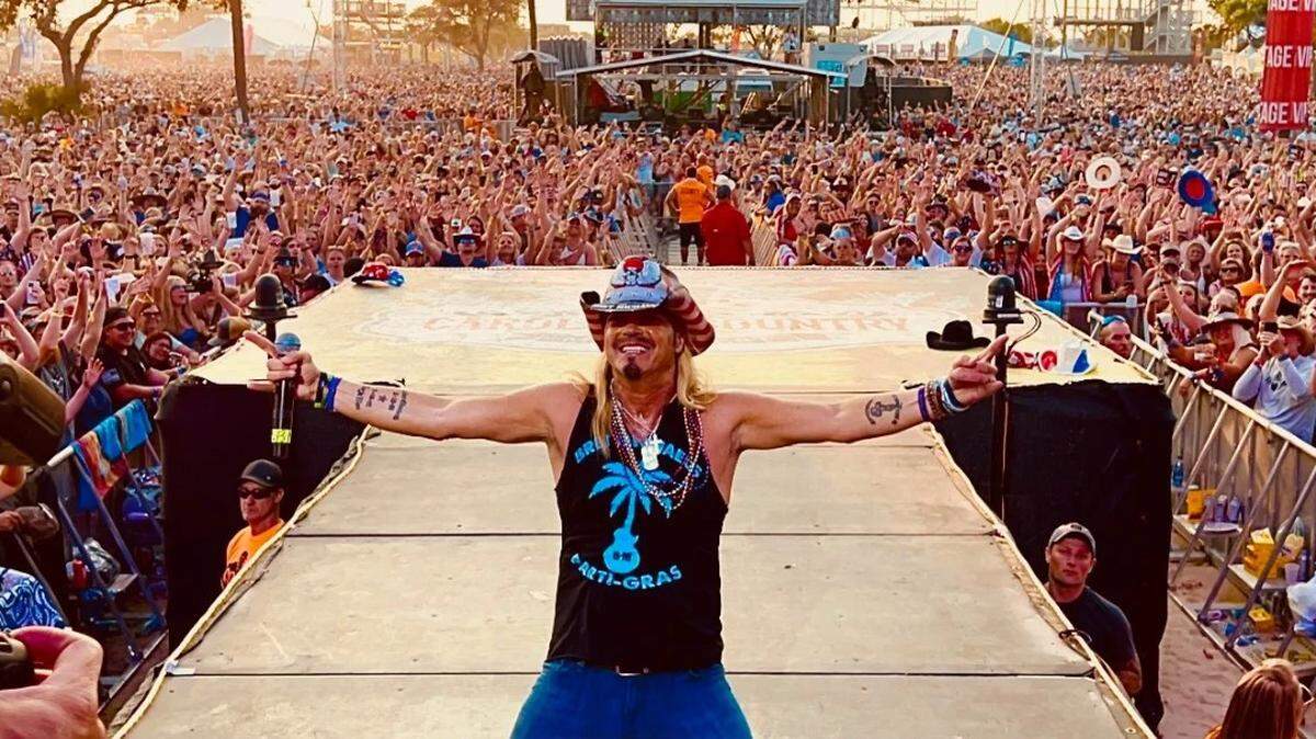 Rock singer Bret Michaels is shown at the Carolina Country Music Festival this past weekend. He is offering CCMF attendees a chance to see him again - for free.