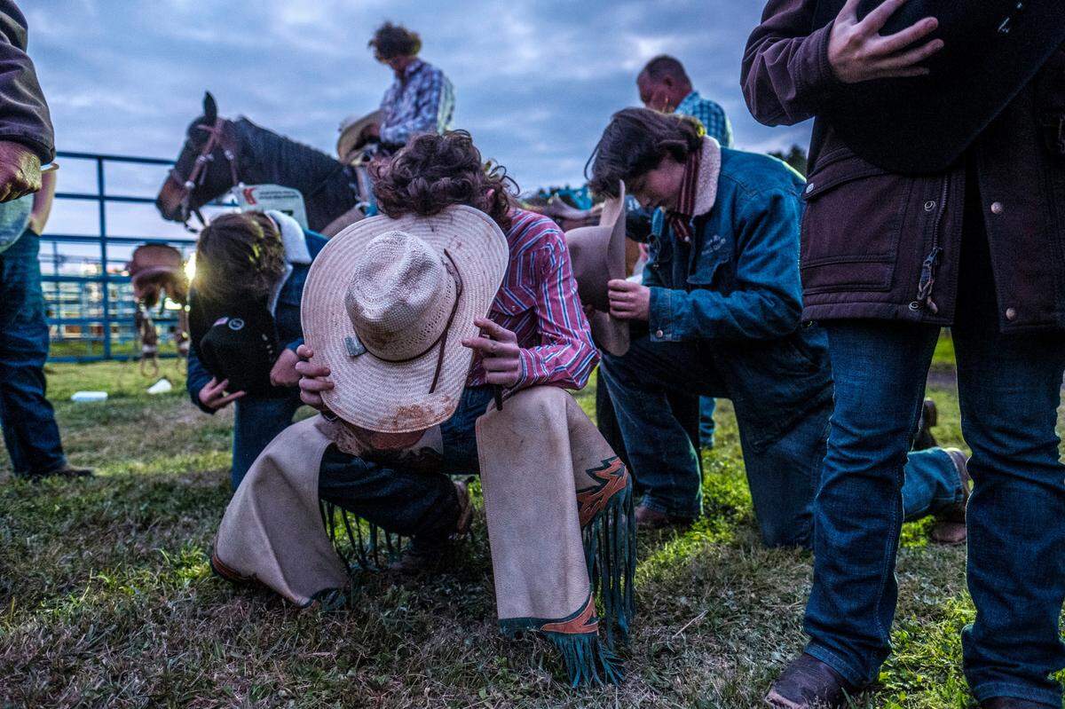 Rodeo contestants pray before the start of the 8th Annual South Carolina High School Rodeo championships being held at RES-LES Farm this weekend outside of Conway, S.C. Over one thousand people attended the rodeo on Friday night. The event continues through Saturday with $10 admission and children age 5 and under free. March 17, 2023