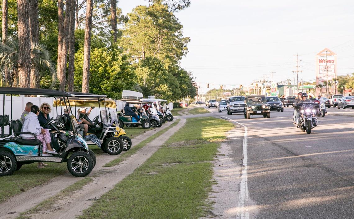 Every evening during the annual Myrtle Beach Spring Bike Rally, members of the Jensen community gather on the side of Highway 17 Business in lawn chairs and golf carts to greet bikers rolling into Murrells Inlet. May 15, 2019.