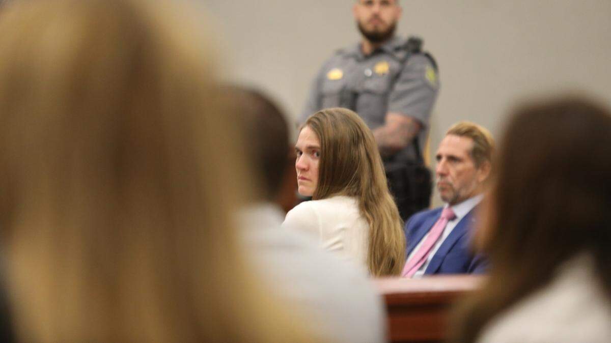 Meagan Jackson looks back during her murder trial. She has been accused of shooting and killing her ex-boyfriend, Greg Rice, and then enlisting the help of a former coroner to dump the body. June 10, 2025.