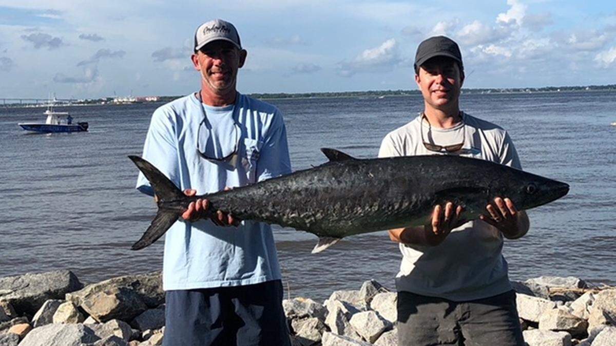 Bryan Baxter and Matt DeAntonio show off the winning 44.20-pound king mackerel in the James Island Yacht Club King Mackerel Tournament earlier this summer.