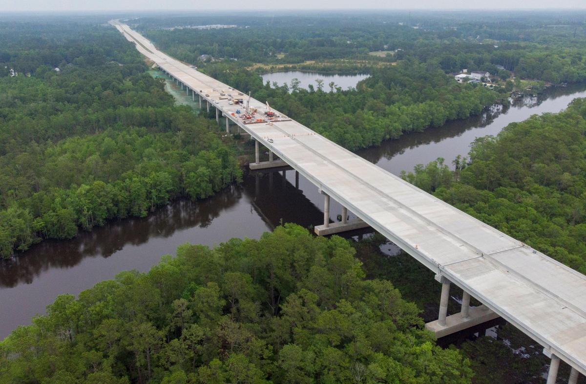 Crews work on the Highway 31 Bridge over the Intracoastal Waterway near Socastee. Extending the corridor to SC 707 has taken longer than expected. The new bridge over the Intracoastal Waterway needs to be resurfaced before the road opens and is not expected to be completed until the fall of 2019.
