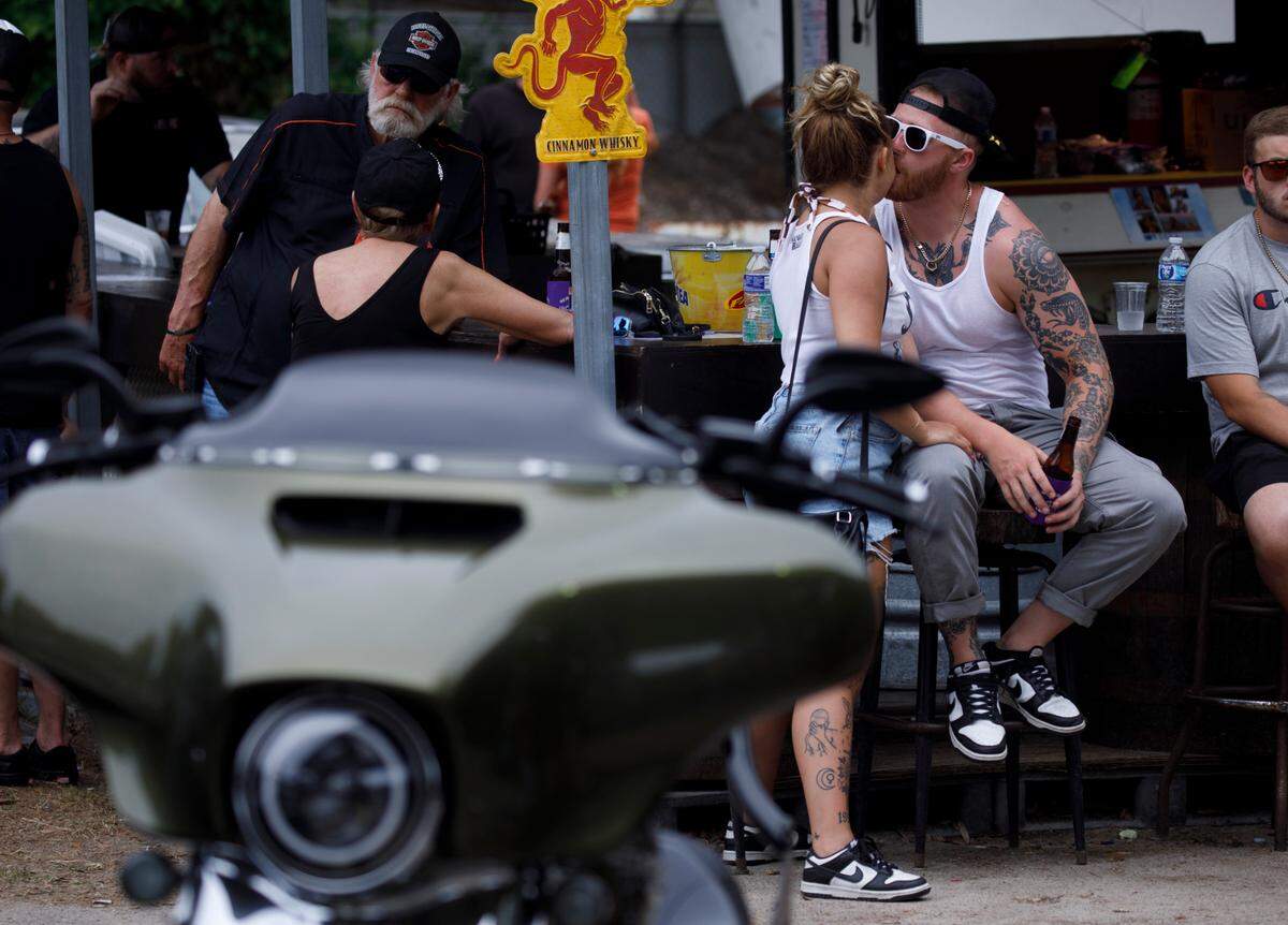 Bikers hang out at Spokes and Bones Saloon in Murrells Inlet, S.C. on Friday during the 2024 Myrtle Beach Spring Rally. May 17, 2024.