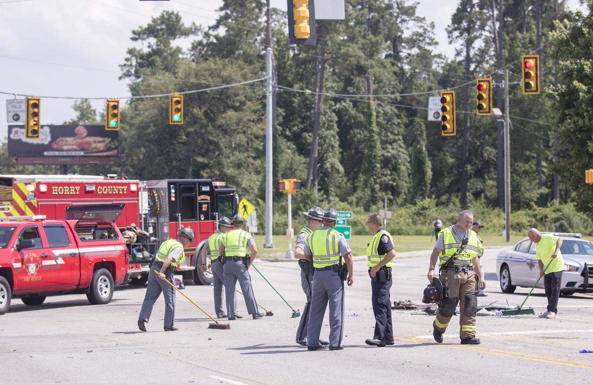 Emergency personnel clean up after a multi-vehicle wreck in Aynor on Tuesday afternoon that resulted in several injuries.July 17, 2018.