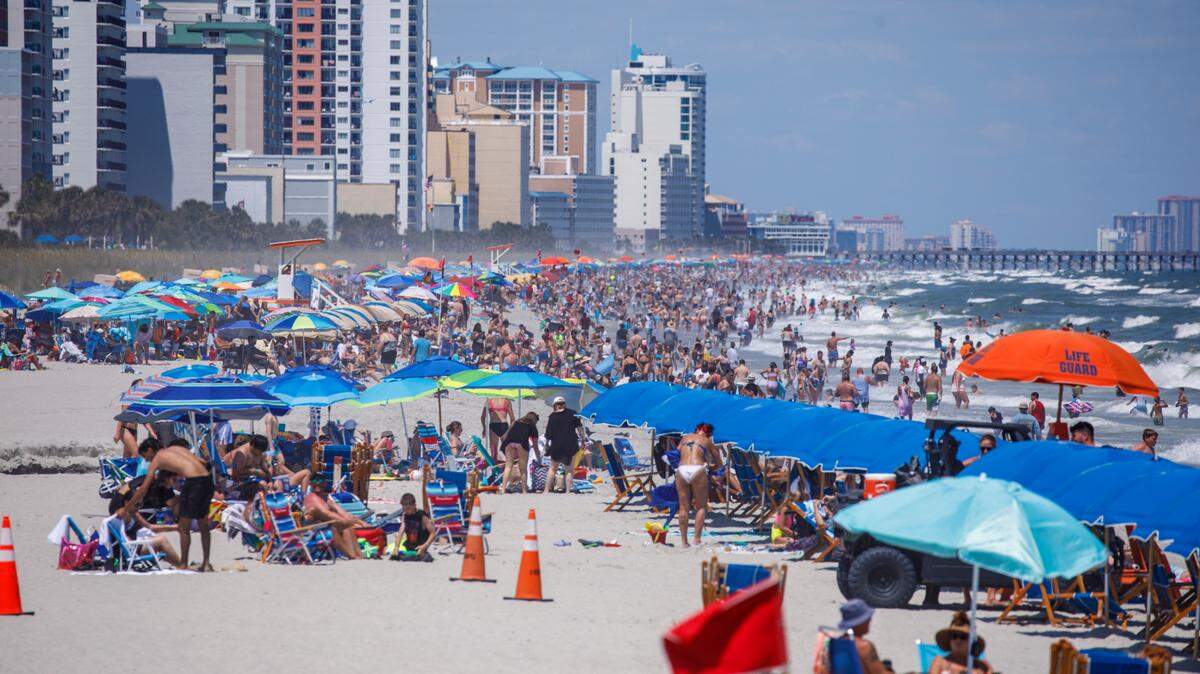View from the Springmaid Pier looking North at swimmers and sunbathers in Myrtle Beach on Tuesday. The week of July 4th is one of the times for tourism in the Myrtle Beach area. July 2, 2024.